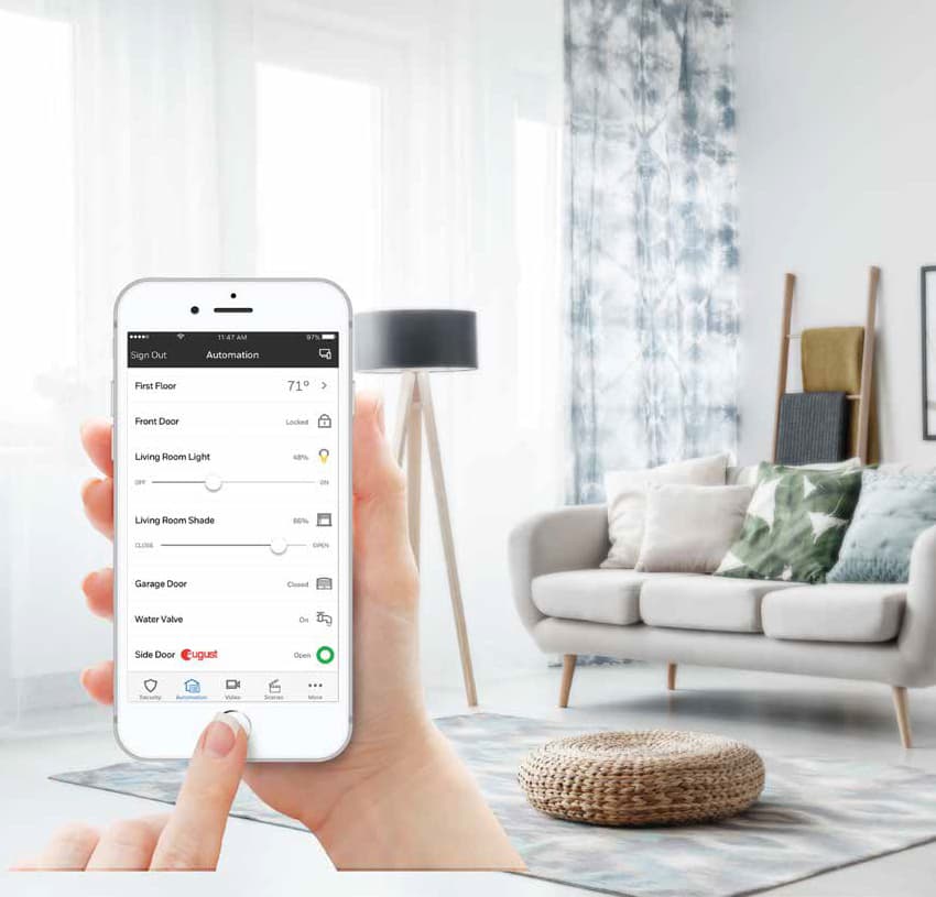 Room with phone showing the Total Connect app